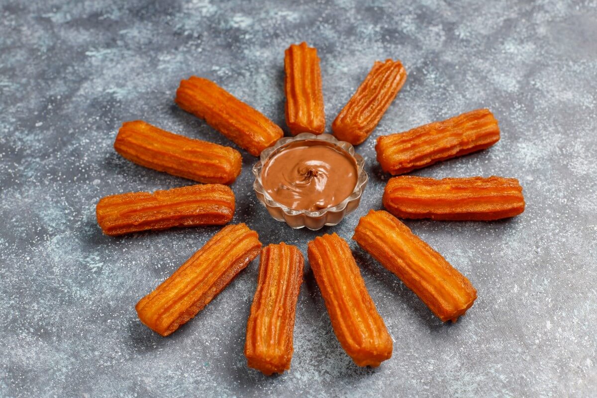 traditional mexican dessert churros with chocolate top view 1